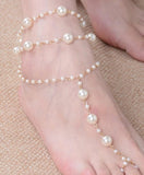 •	Simulated fresh white pearl anklet w/attached toe ring •	Prepare for compliments with this sweet white layered pearl anklet and attached toe ring •	Approx. 8.5” for a comfortable fit •	Remarkable Quality •	Often called beach sandals