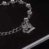 •	Beautifully crafted anklet rarely seen •	Beautiful Antique Silver plating •	Exceptional Quality •	Sexy Foot Fashion with beautiful daisy flowers and a dangling heart •	Metal / Lead Free  •	Approx. 8.5” length to comfortably fit the ankle 