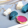 •	Stunning white, blue, and hot pink natural stones •	2.9-inch drop set in gold  •	Remarkable quality •	Prepare for compliments!