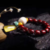 Amazing sculpted polished sandalwood and amber bracelet with a gorgeous white stone bead and a creamed greenish blue pop of color. Special fine jewelry Shop Now