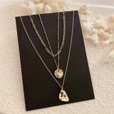 •	Beautiful set of three Multi Layered fun necklaces all in one package •	16” 18” and 20” set of three beautiful irregular shaped gold coins •	Fun to wear, trendy, and beautiful to look at •	Excellent quality •	Prepare for compliments!