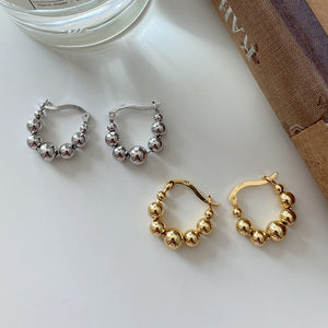 •	Gold plated sterling silver or sterling silver beaded hoops •	Impeccable quality, fine jewelry •	Lead and Nickel Free, 1-inch round •	Prepare for compliments! •	Small beautiful minimalist dream